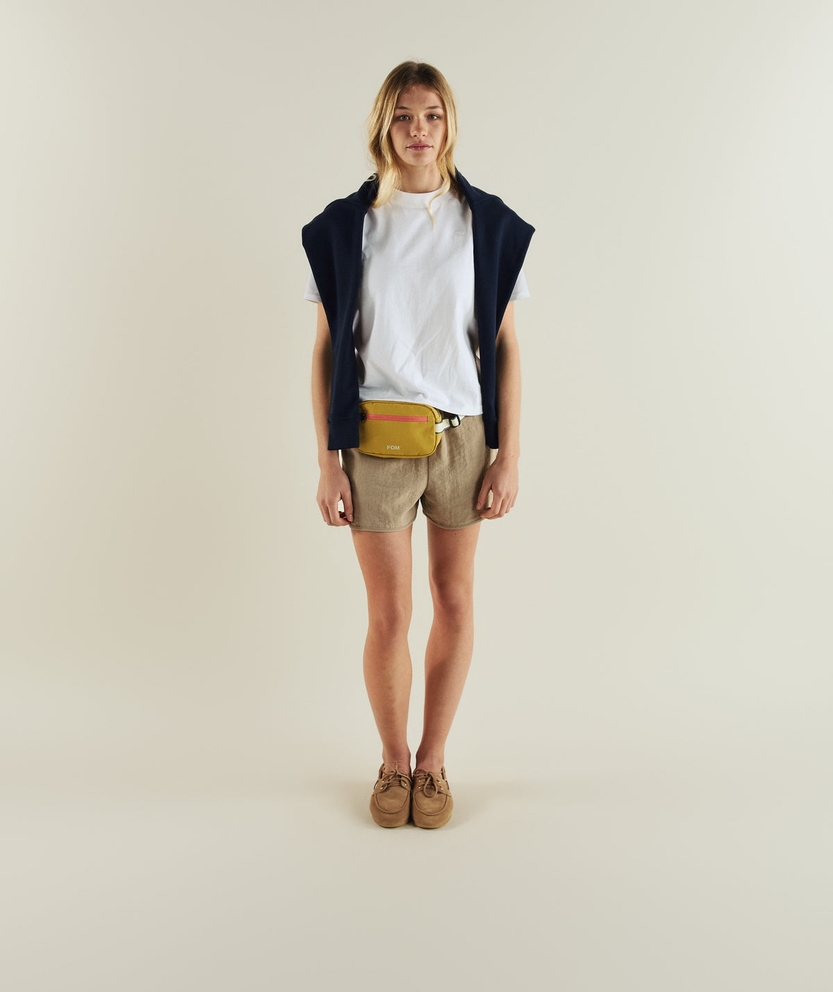 Woman wearing FOM ladies regular tee in white