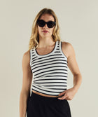 Woman wearing FOM ladies stripe tank in black and white