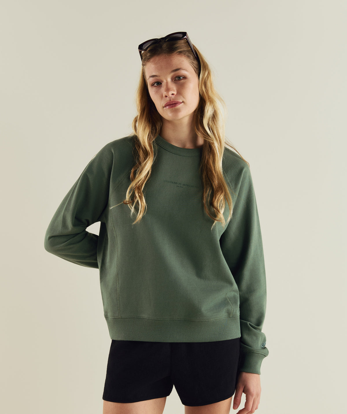 Woman wearing FOM ladies textured crew neck sweat in sage green