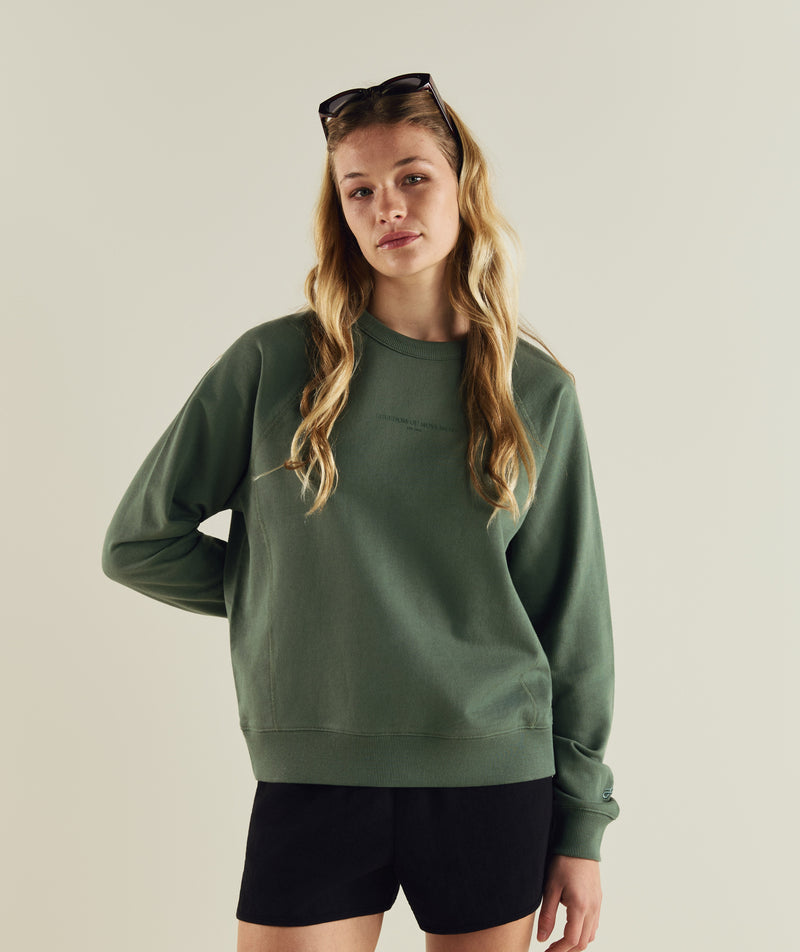 Woman wearing FOM ladies textured crew neck sweat in sage green