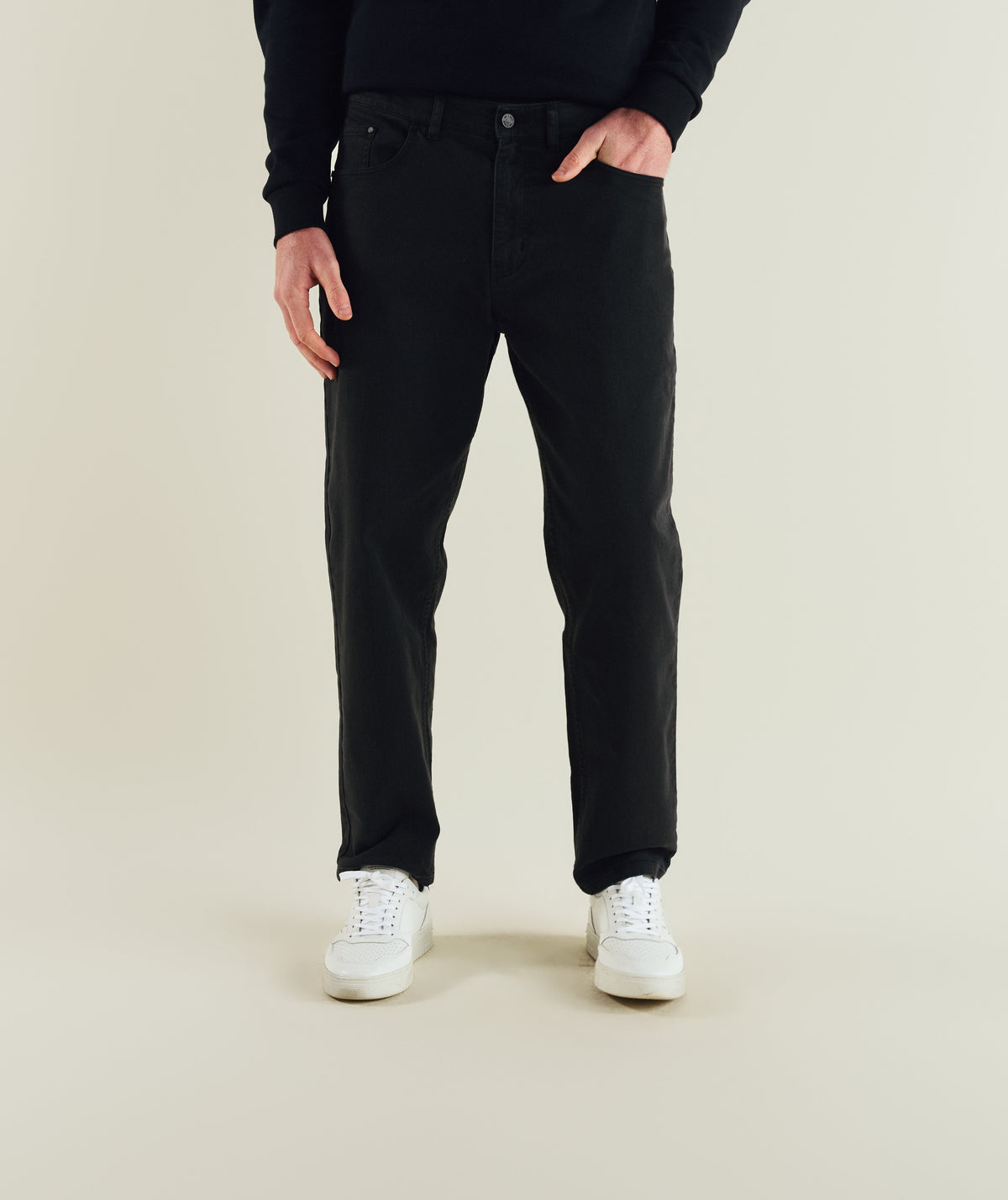 Man wearing FOM x Kolisi denim pants in black